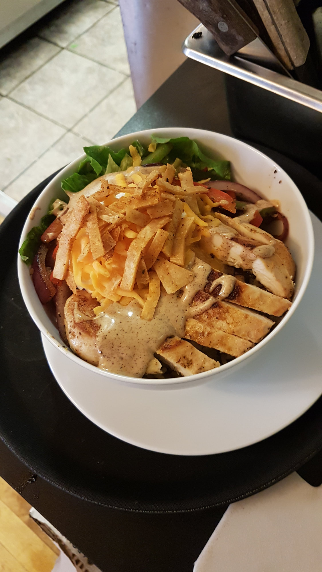 Chicken salad bowl with tortilla strips